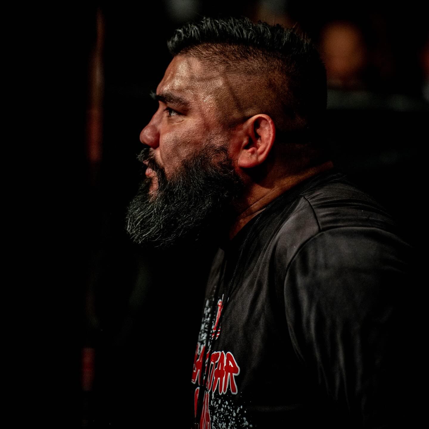 Professor Danny Salinas watches the mats from the corner