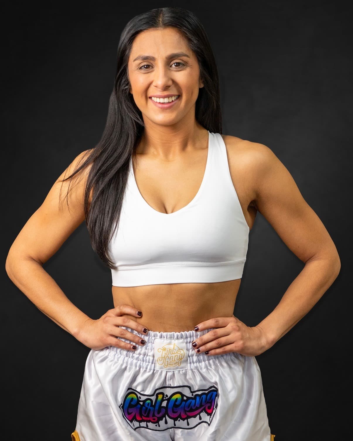 Kayla Sustaita in fight kit against a black backdrop